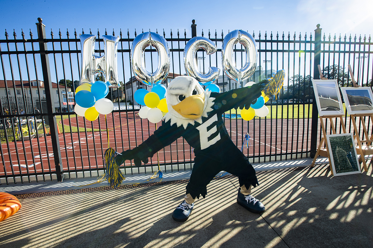 Swoop in front of a HOCO banner