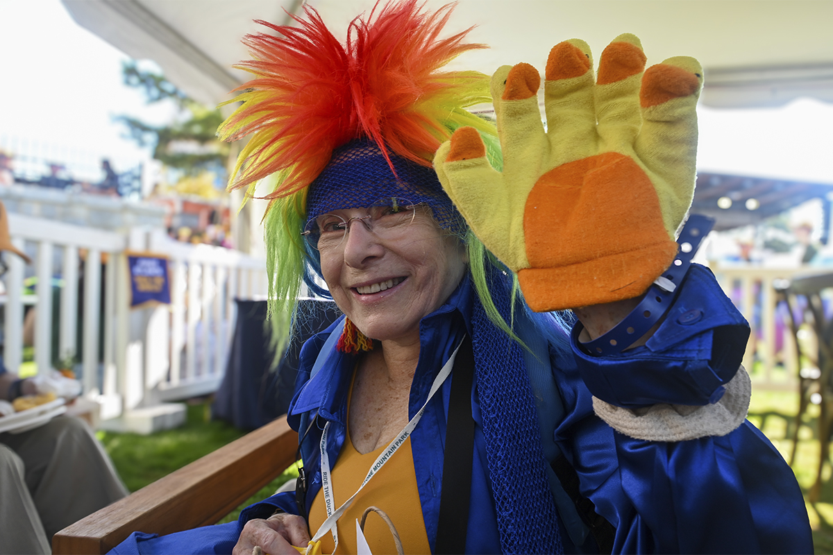 woman in costume waves