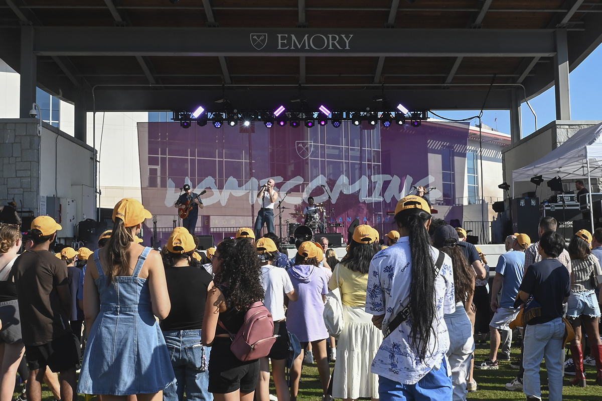Facing the stage, the sign reads Emory Homecoming