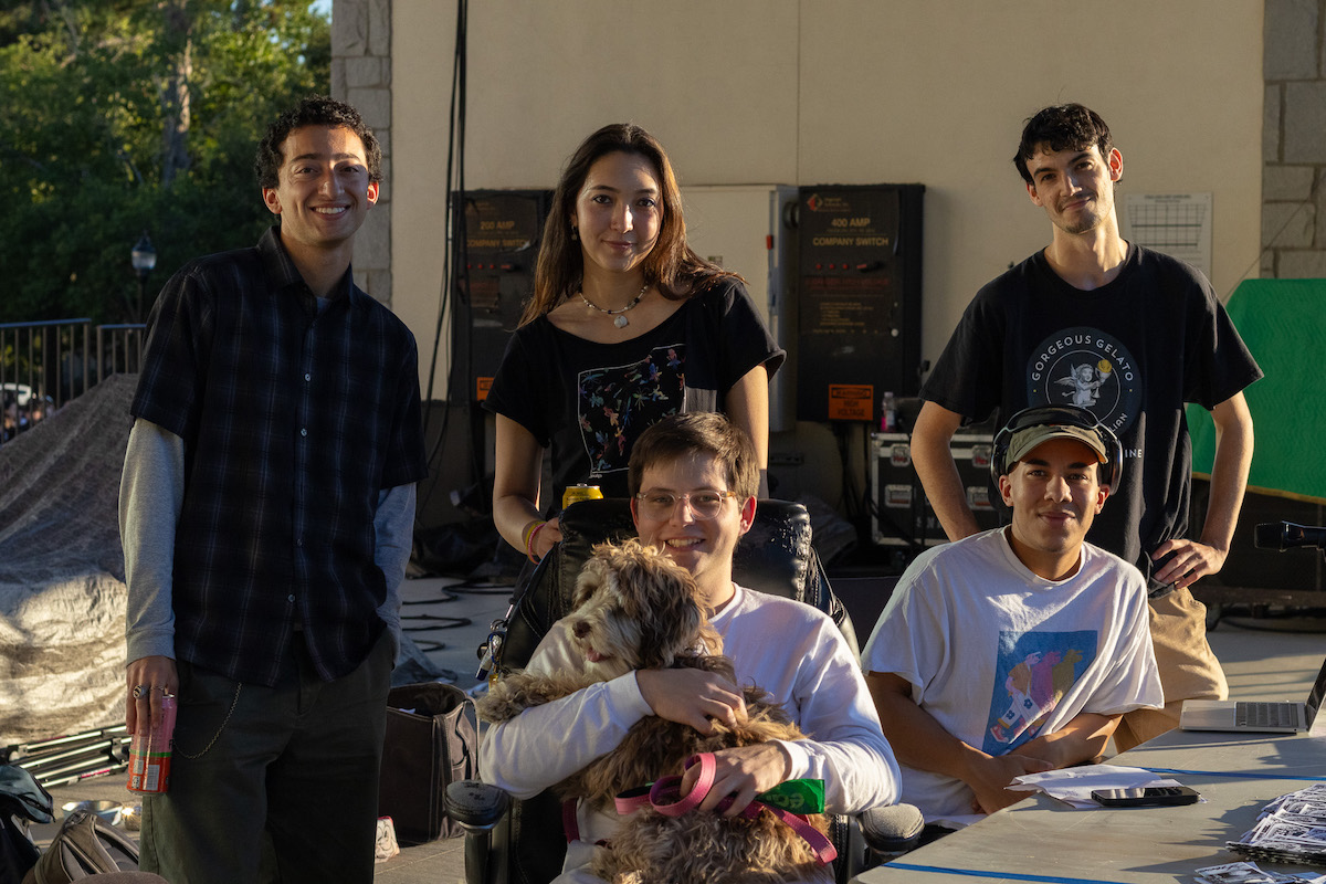 Group of people standing next to one another