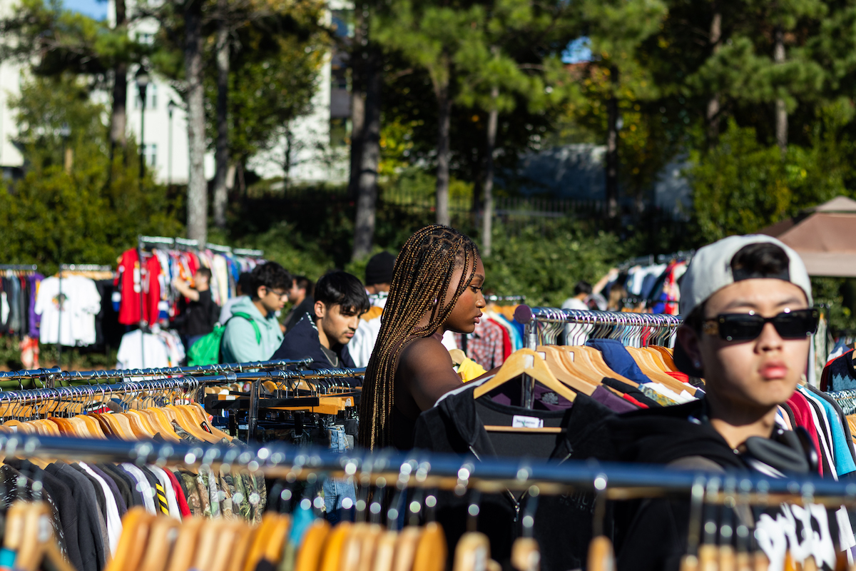 Students looking through clothing racks