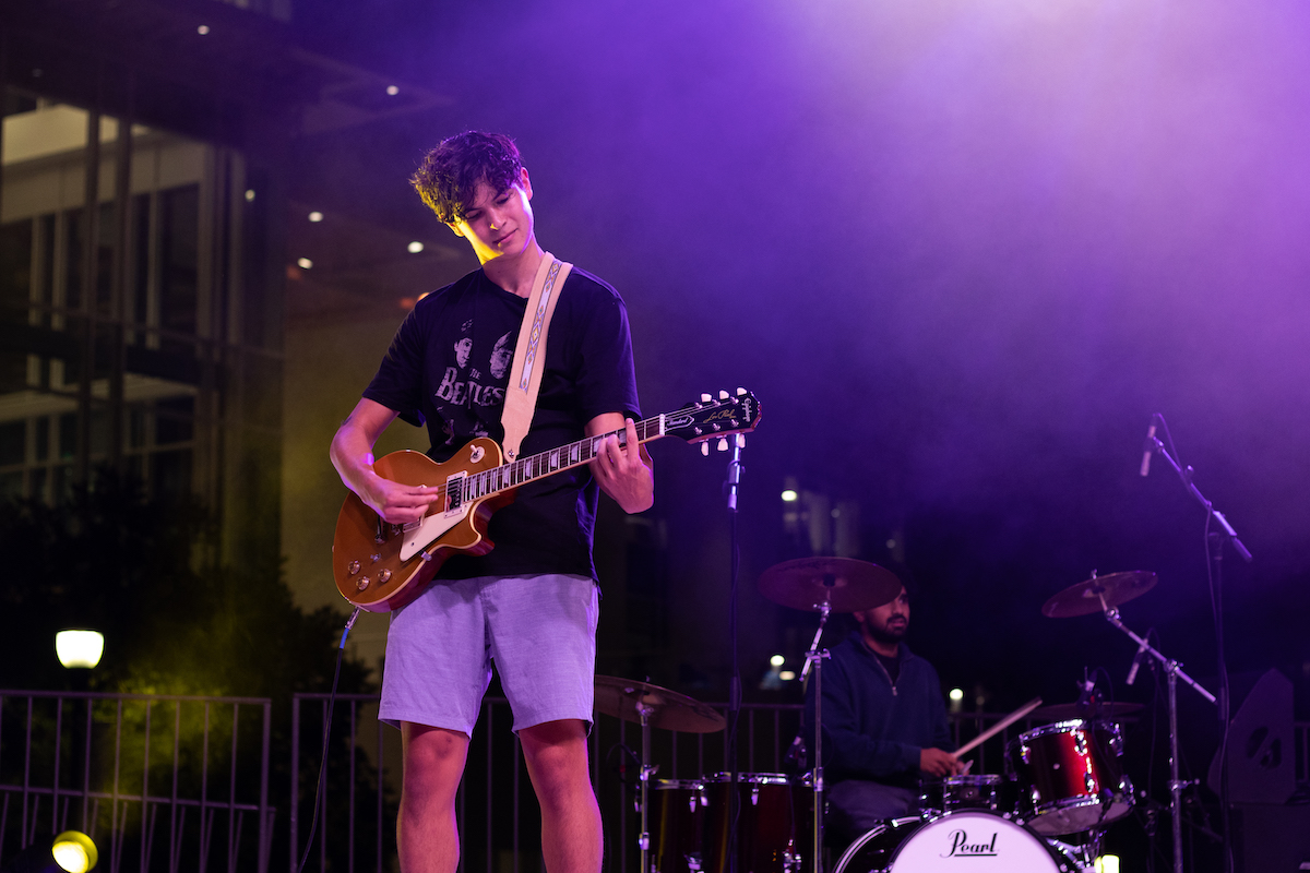 Student playing guitar 