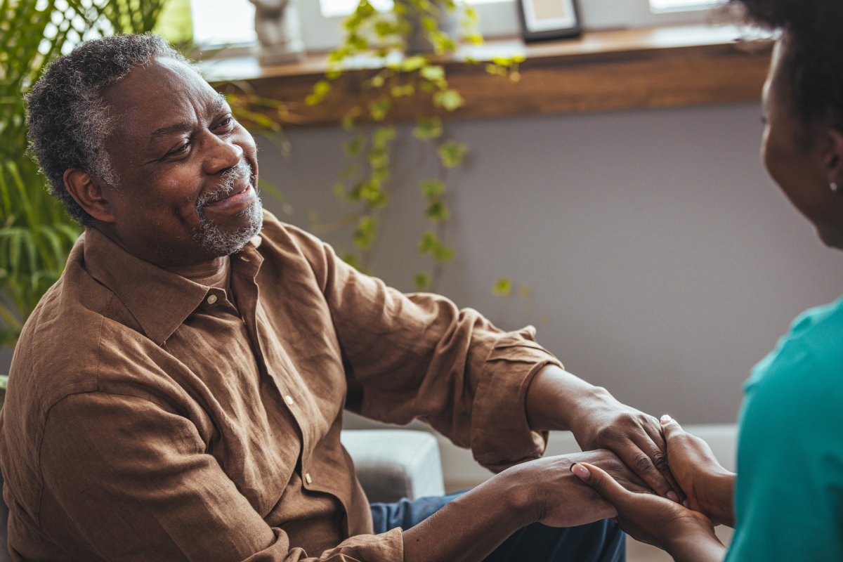 Elderly black man holding hands with Black woman