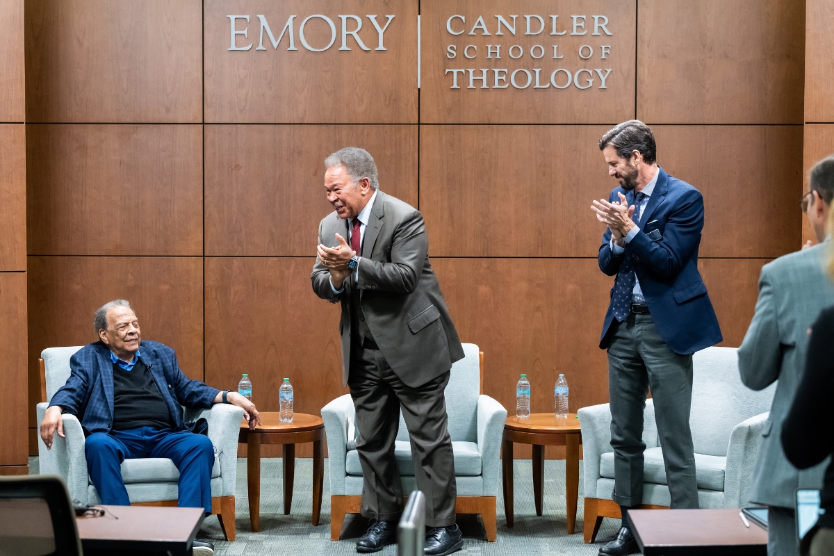 Emory University professors Robert Franklin and Joseph Crespino applaud for civil rights activitst and former US ambassador Andrew Young