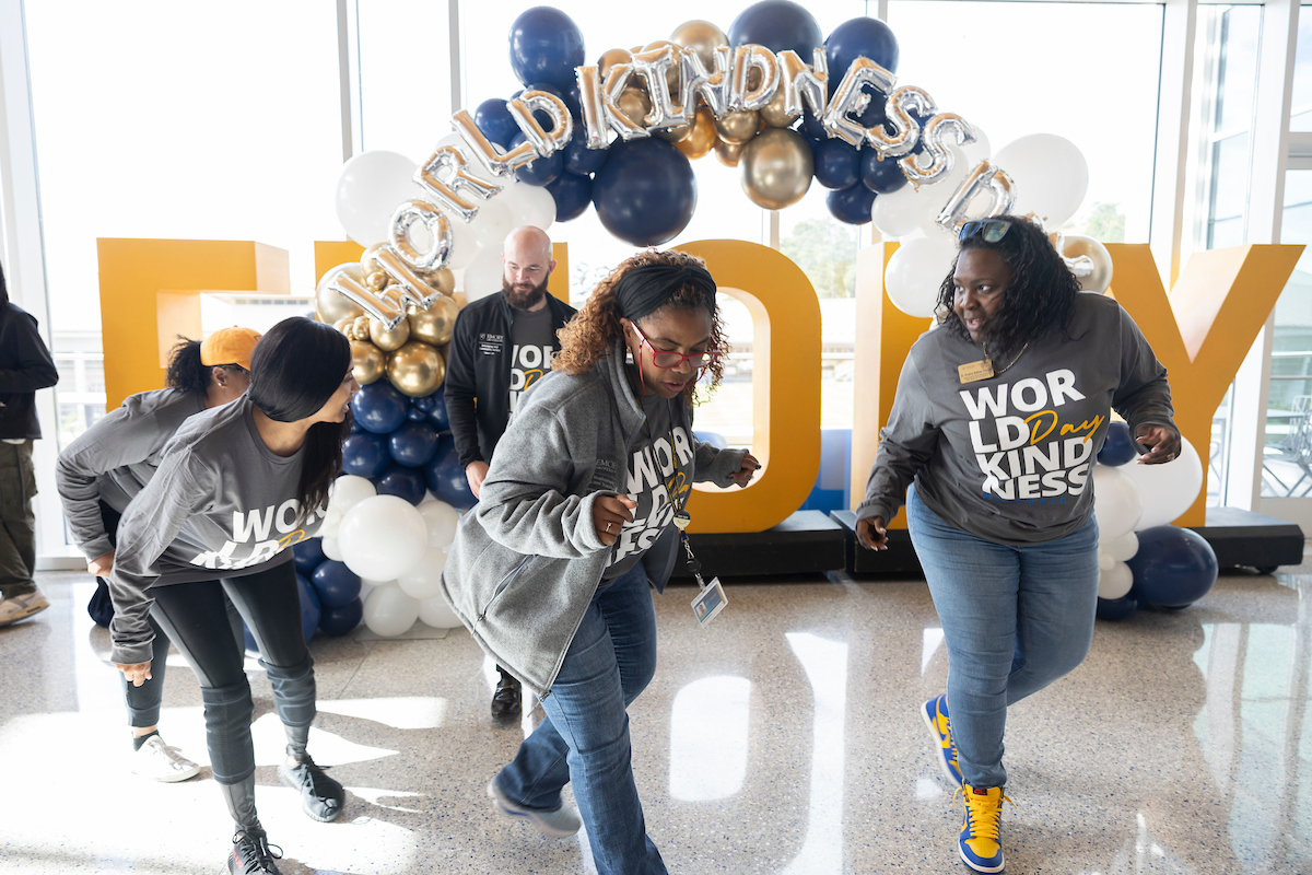 People dancing in student center