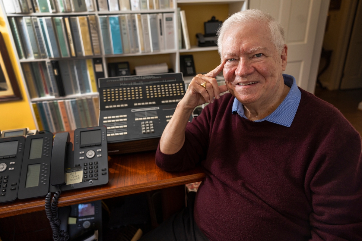 Joseph Massey with old telephone equipment