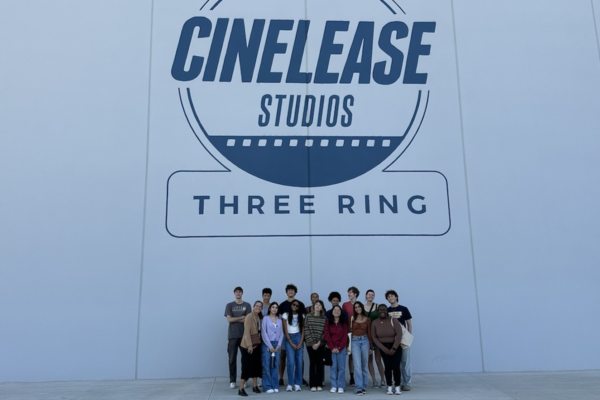 group photo in front of cinelease studios sign