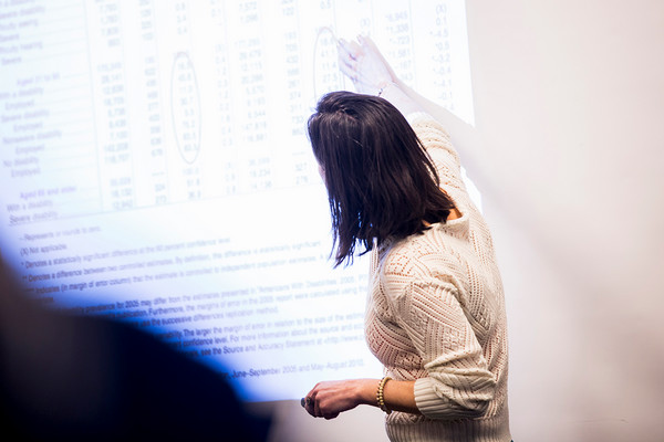 photo of faculty member writing on board