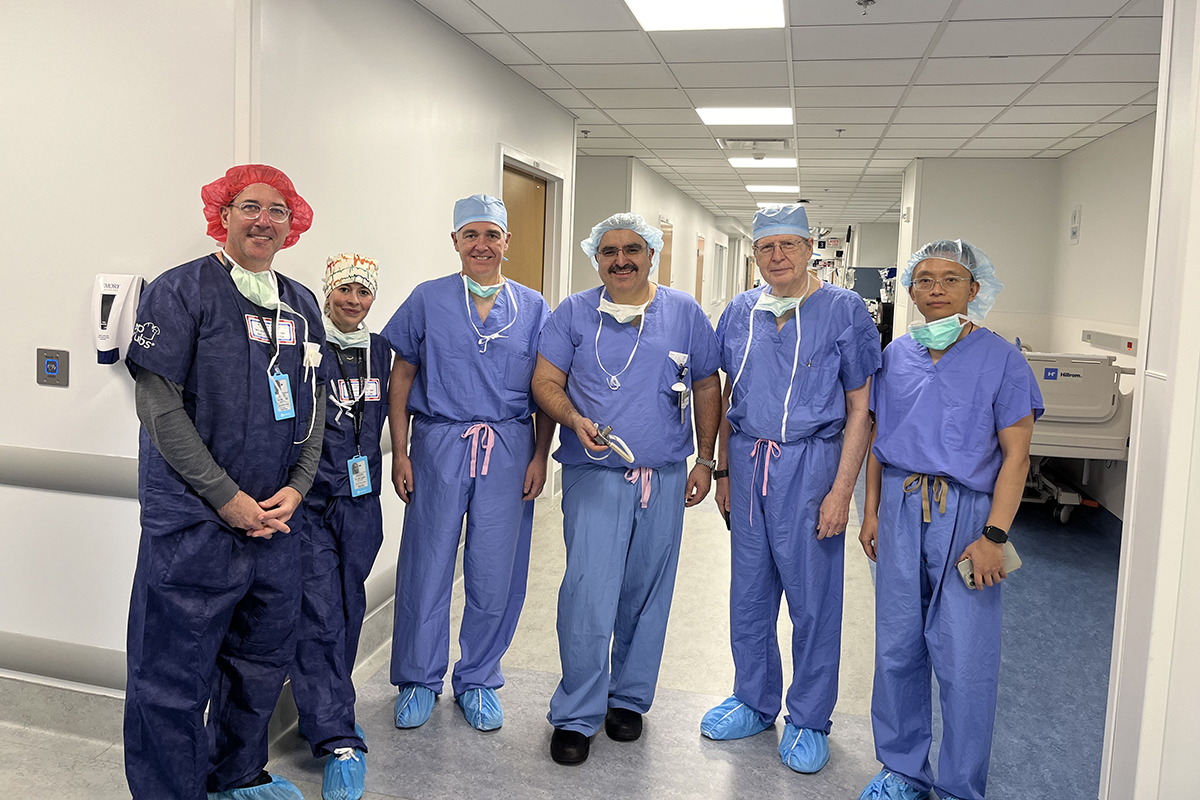 Team of surgeons at Emory University Hospital in scrubs and other protective gear