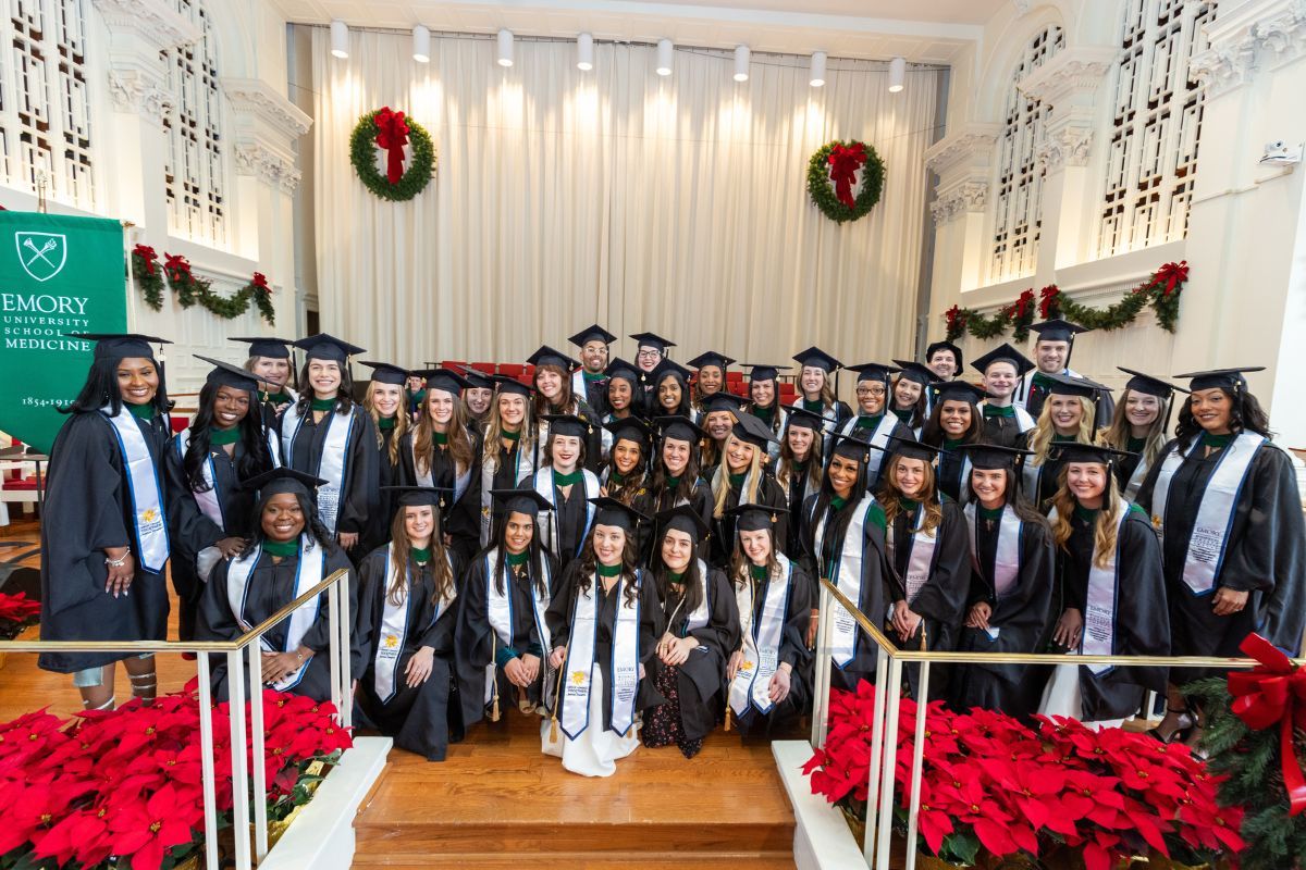 graduates of the program dressed in regalia  