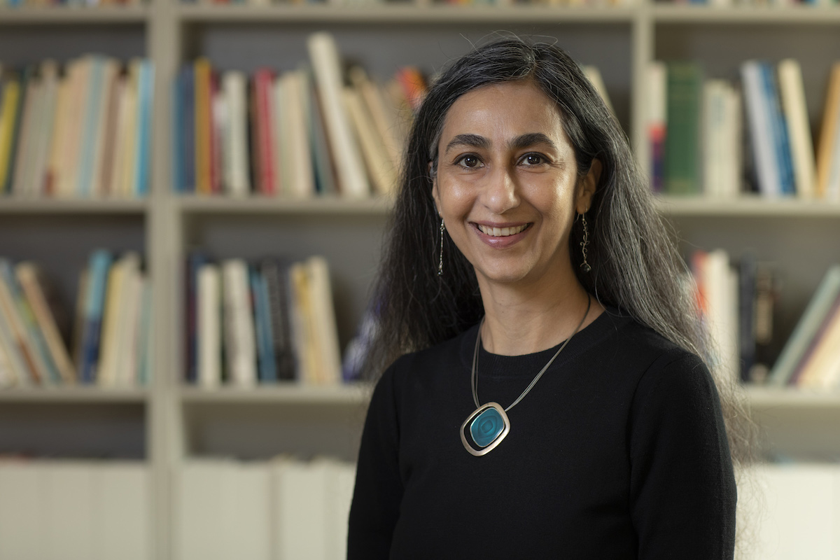 professor Ruby Lal in front of a bookcase full of books