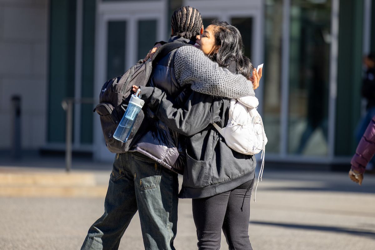 students hugging