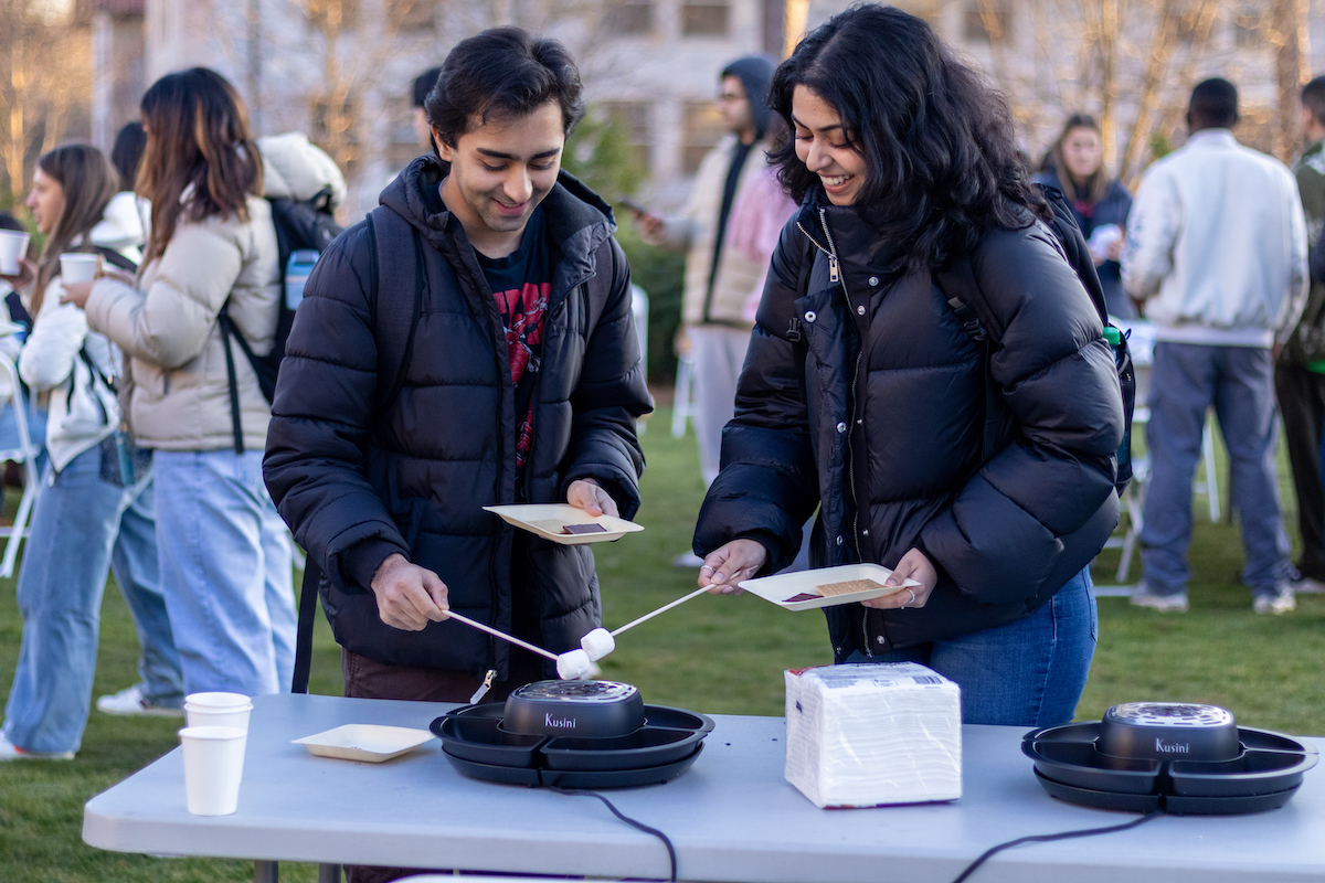 students roasting marshmallows 