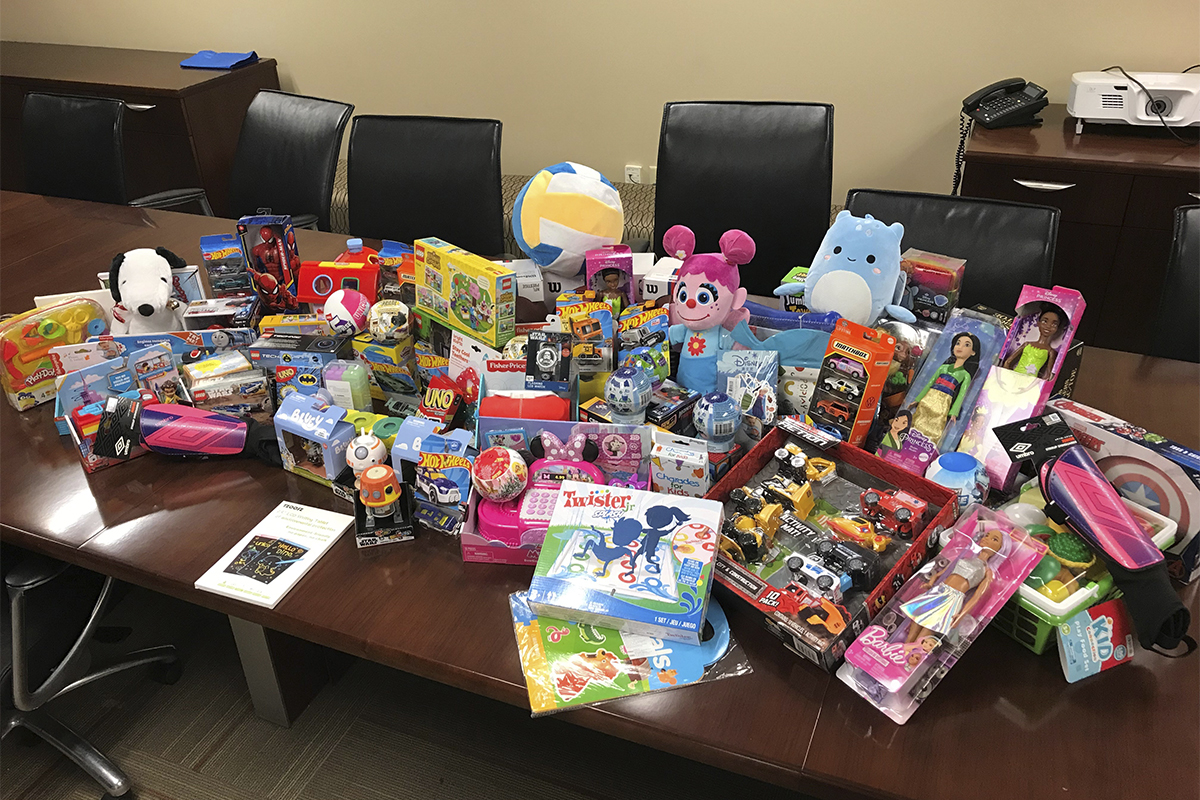 piles of new toys displayed on table