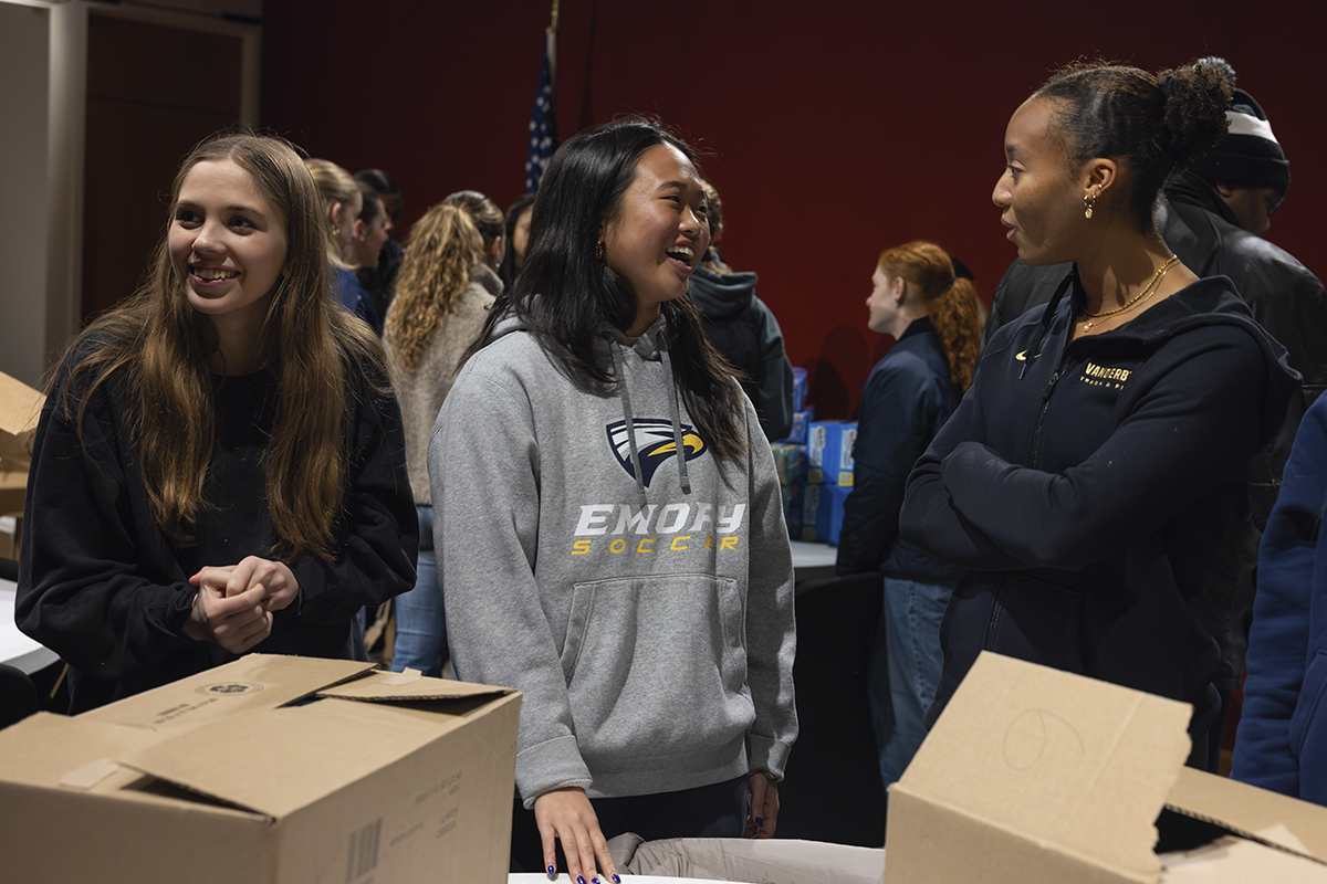 college students packing boxes for service project