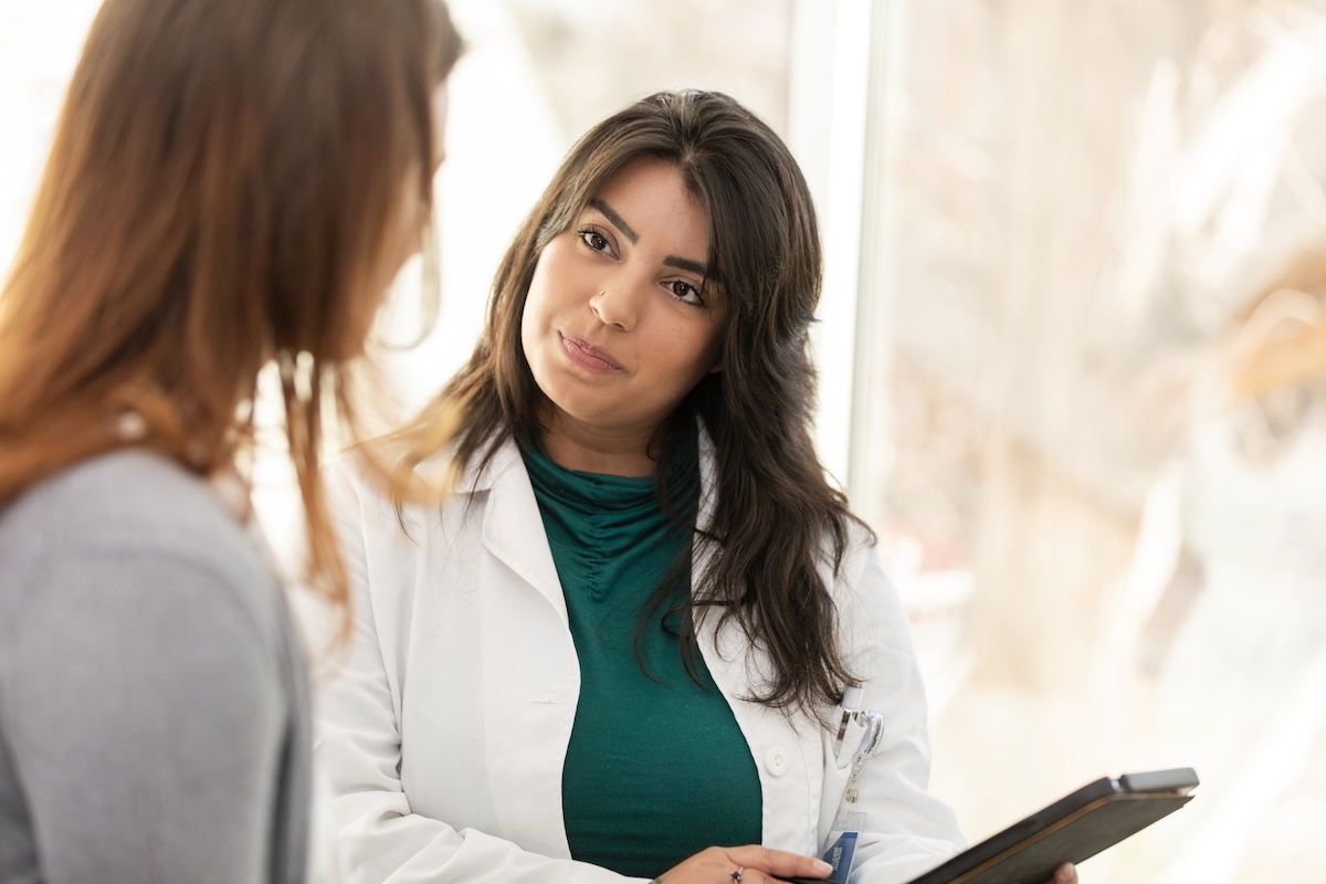 photo of nurse consulting with patient