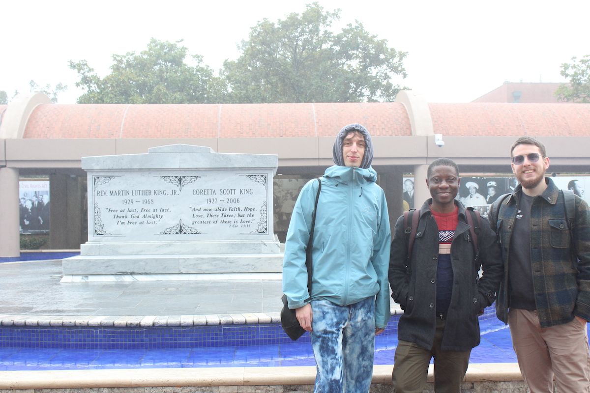 students in front of gravesite 