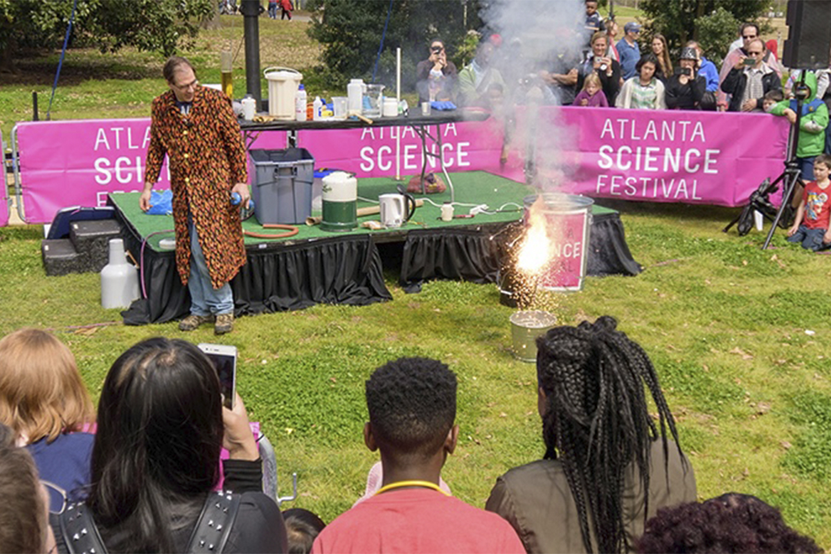 crowd watching an outdoor science experiment