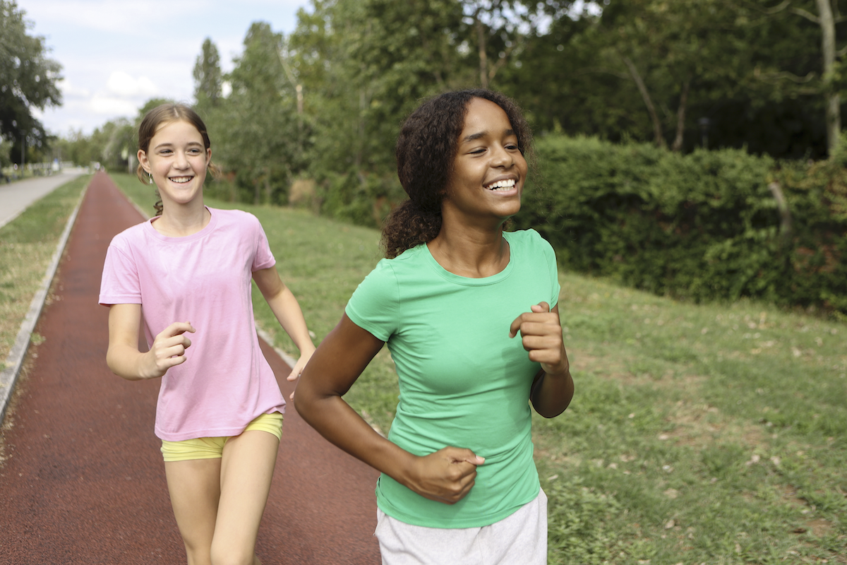 Teenage girls running