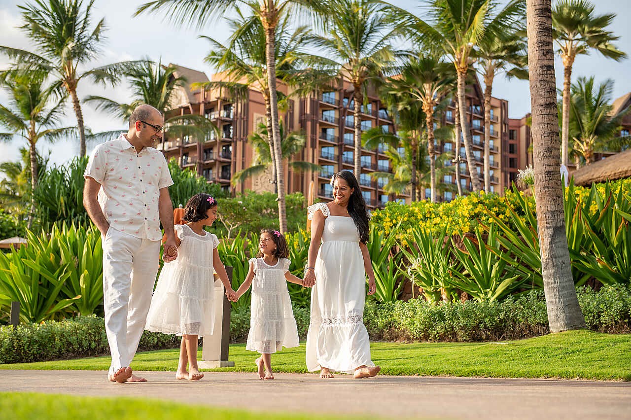 Divya and Ravi with their two kids on vacation.