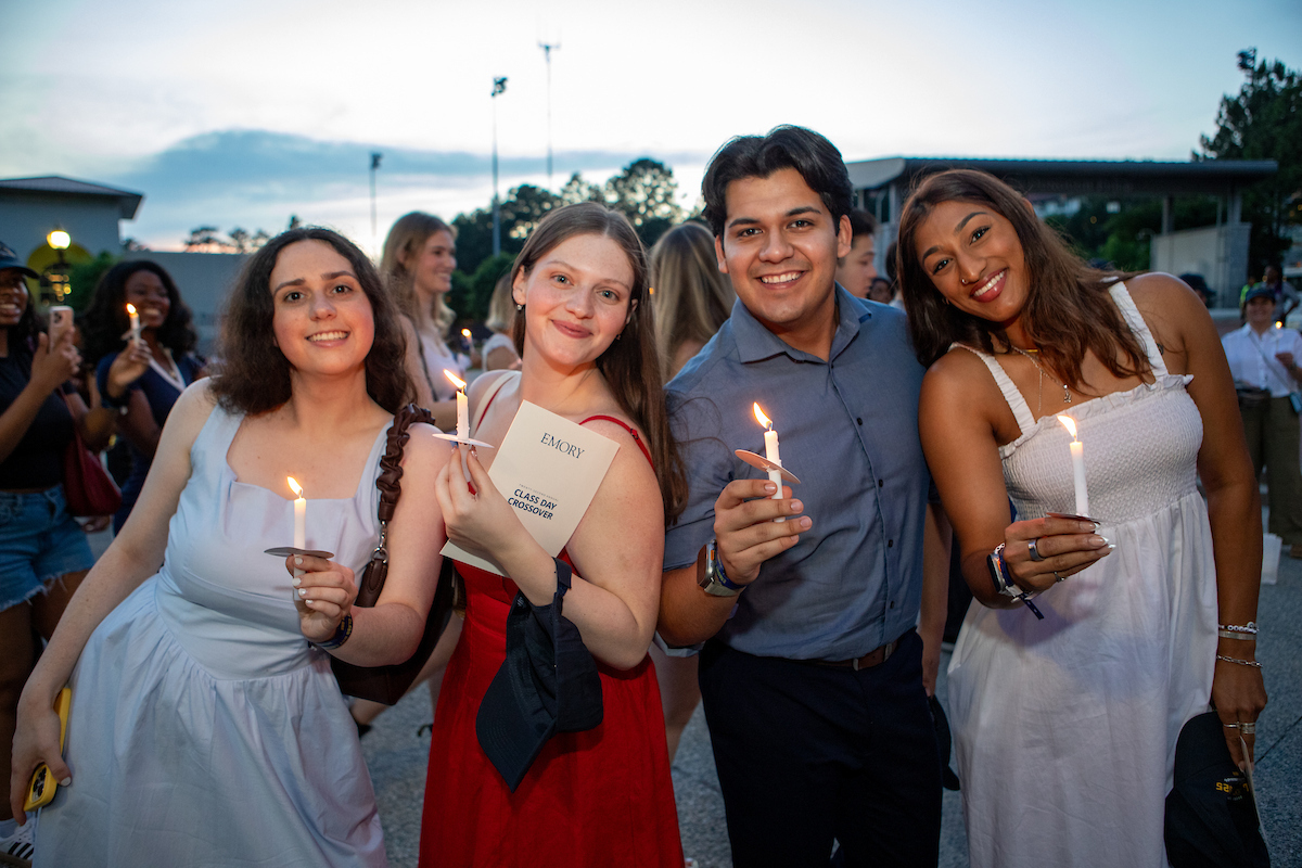 students holding candles at crossover 
