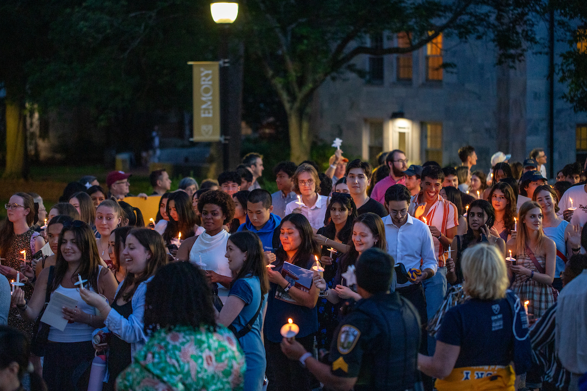 students holding candles at crossover 
