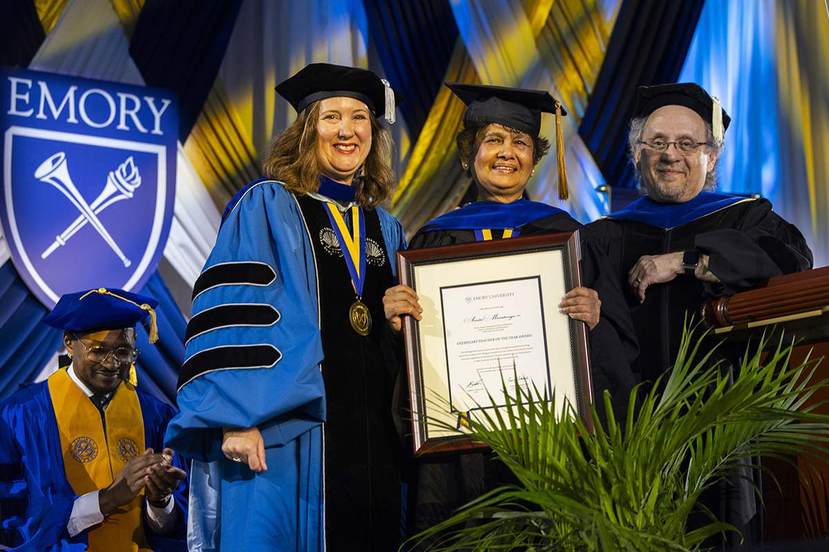 Emory professor Molly McGehee holding award plaque