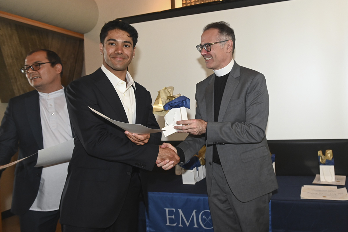 male college student receiving certificate