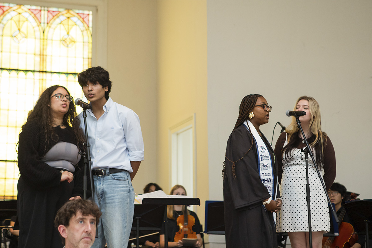 college quartet singing on stage