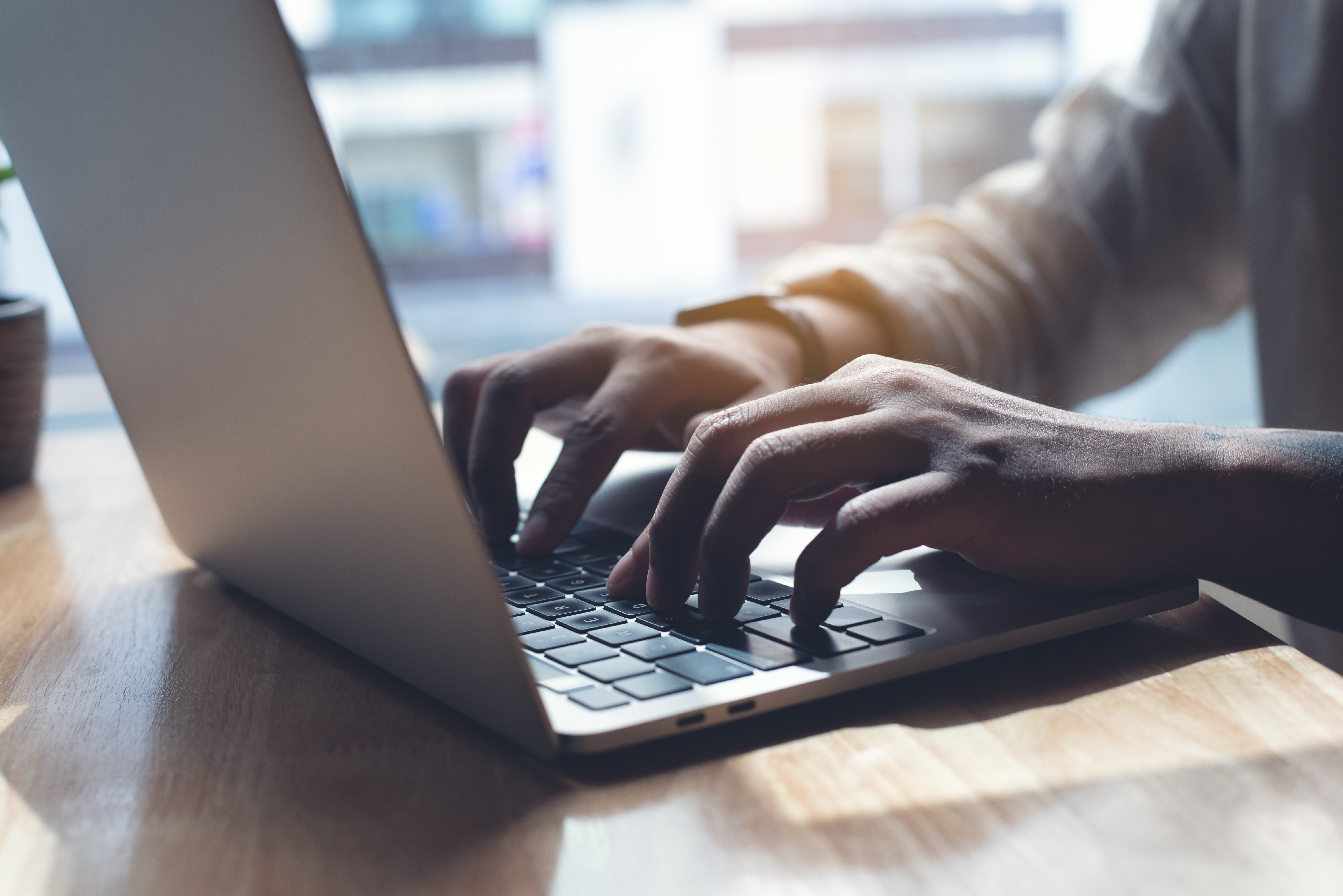person typing on keyboard