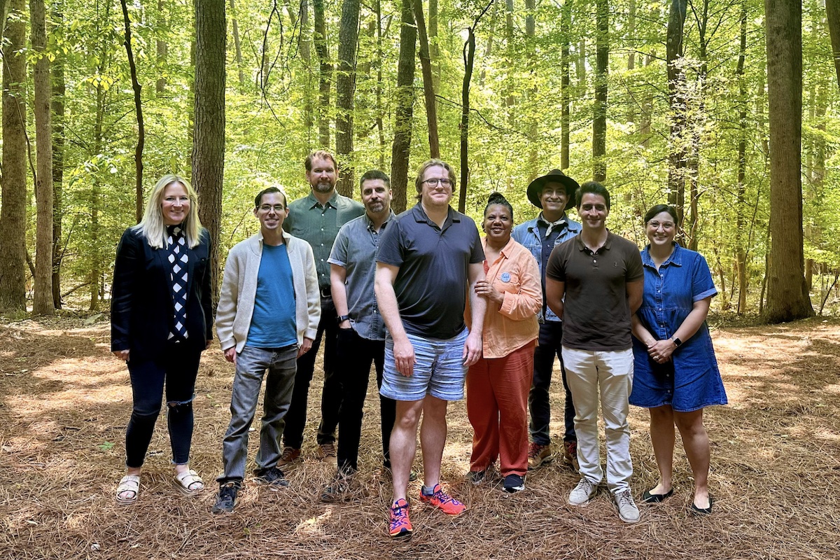 Group of faculty members in the woods