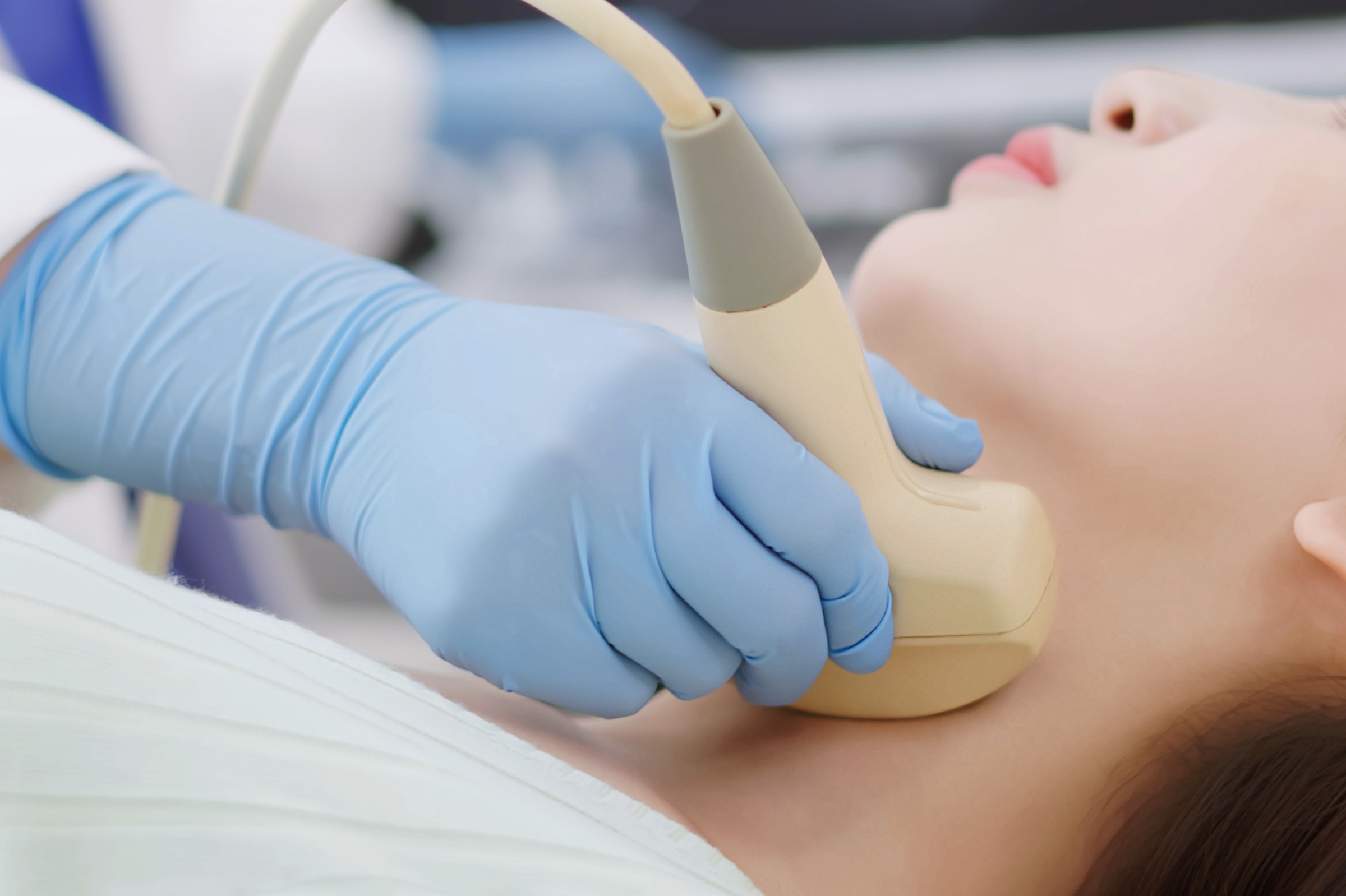 Patient being examined for throat cancer
