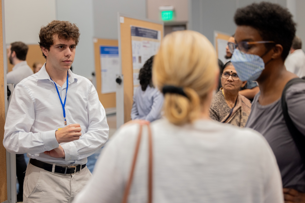 student at poster presentation
