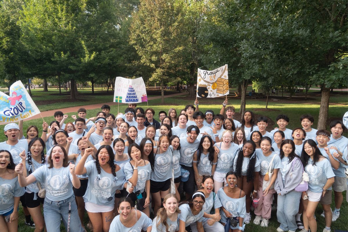 group of students in light blue t-shirts 