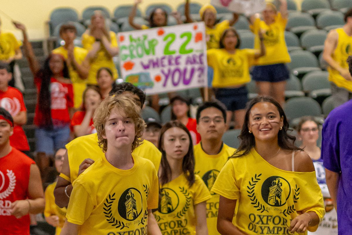 students in yellow t-shirts playing a game in the Oxford Olympics
