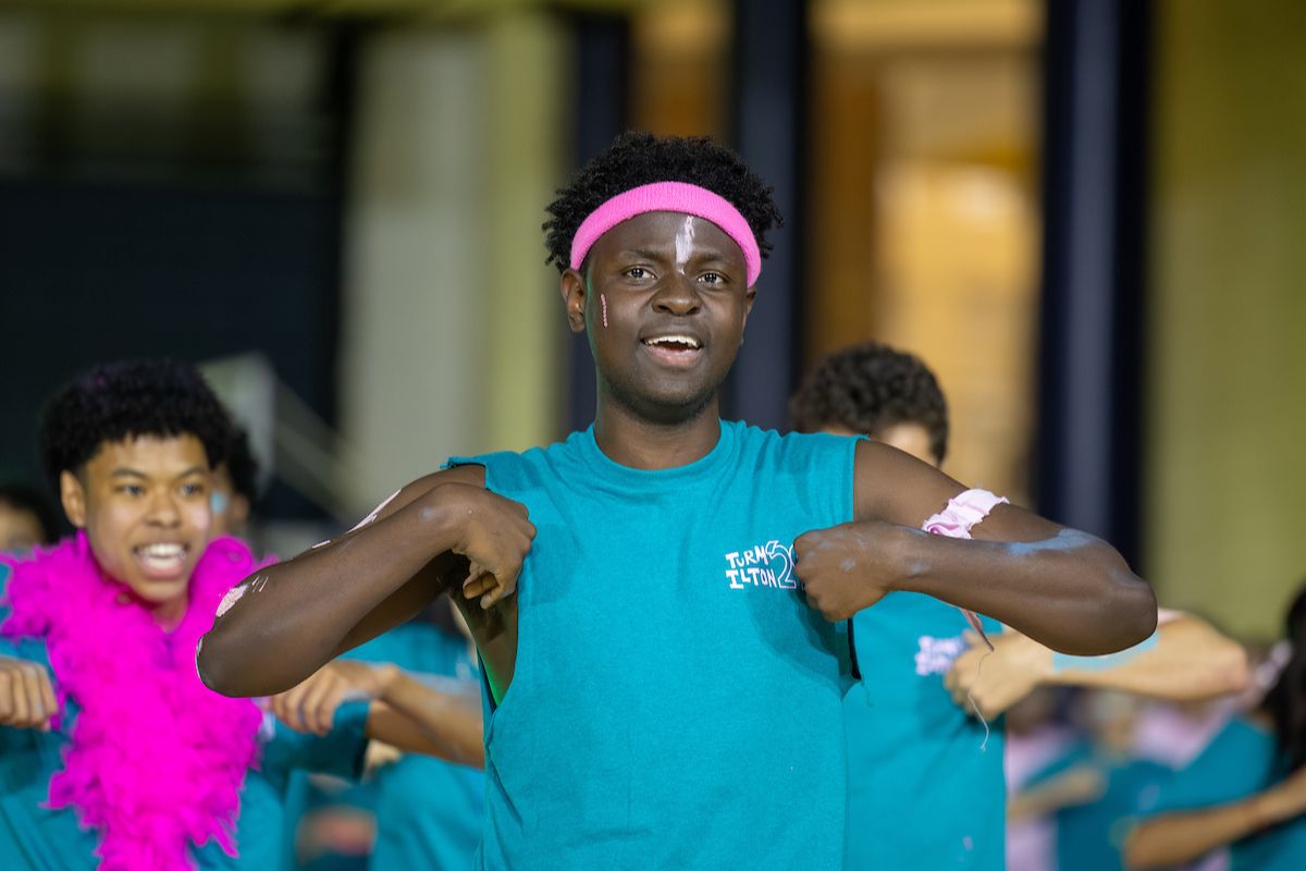 male student dancing during Songfest 