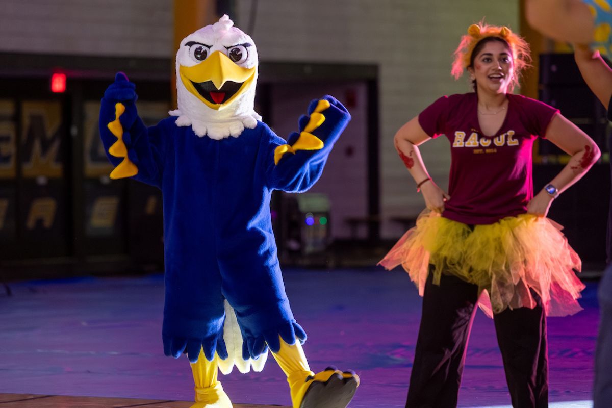 Swoop and a student dancing during Songfest 
