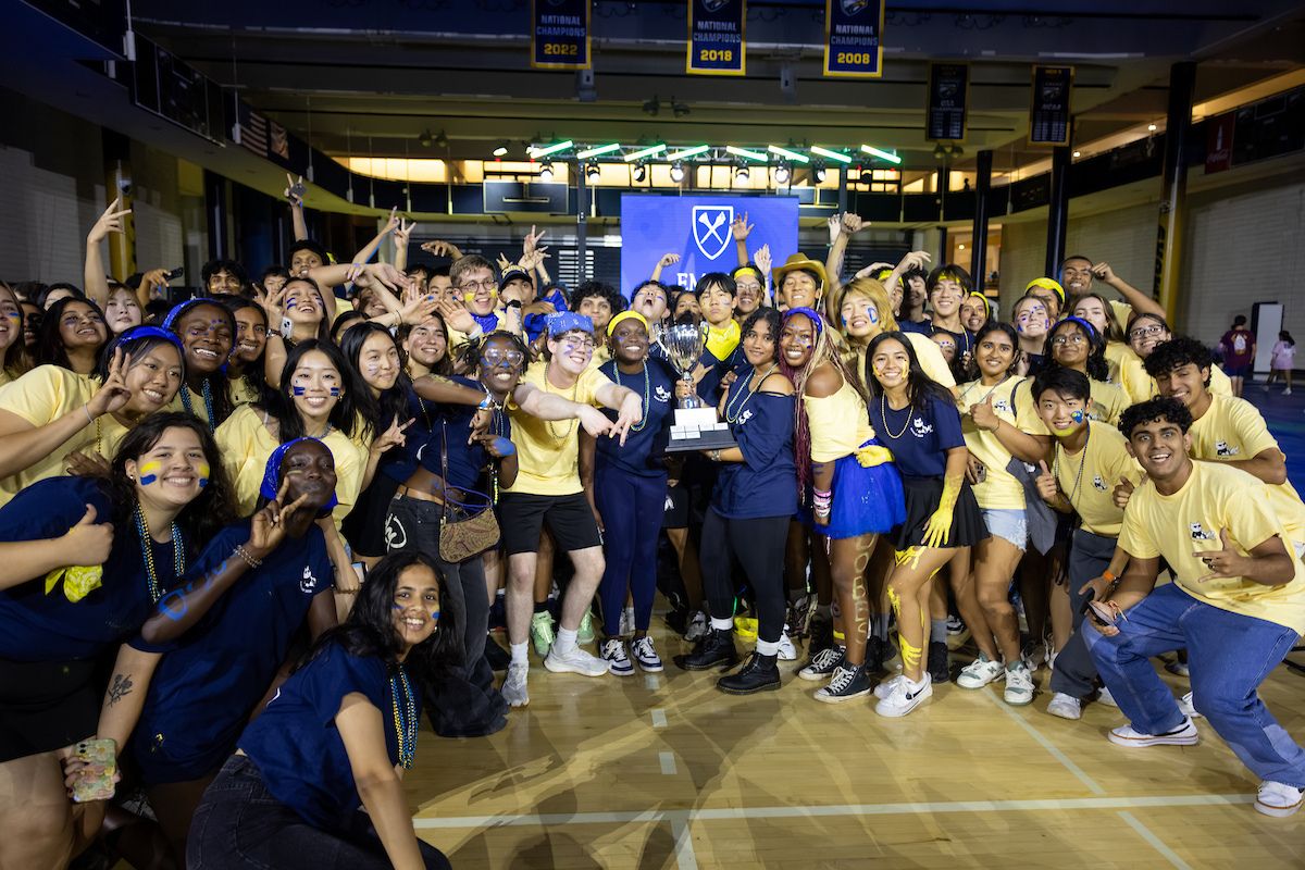 group of students from aladobbs holding the Songfest trophy