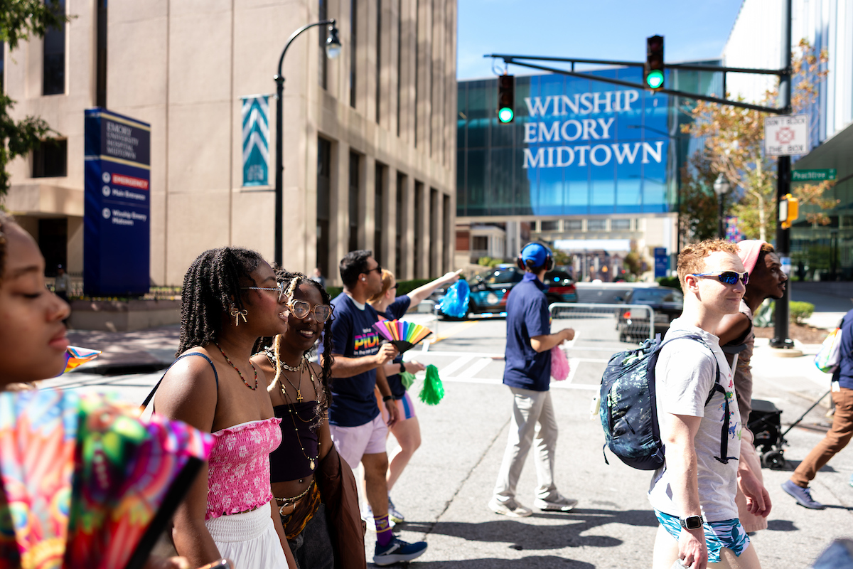 The parade passes by Emory Winship Cancer Institute's Midtown location