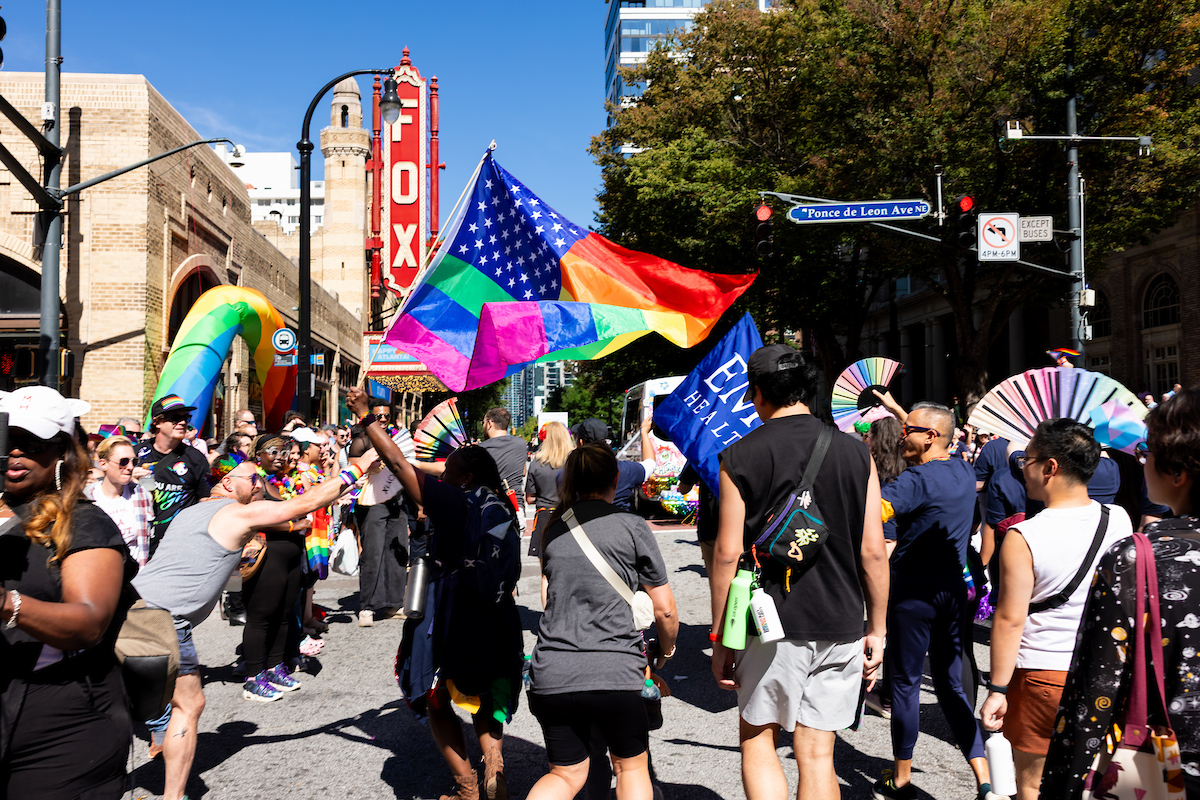 The parade passes the Fox theater