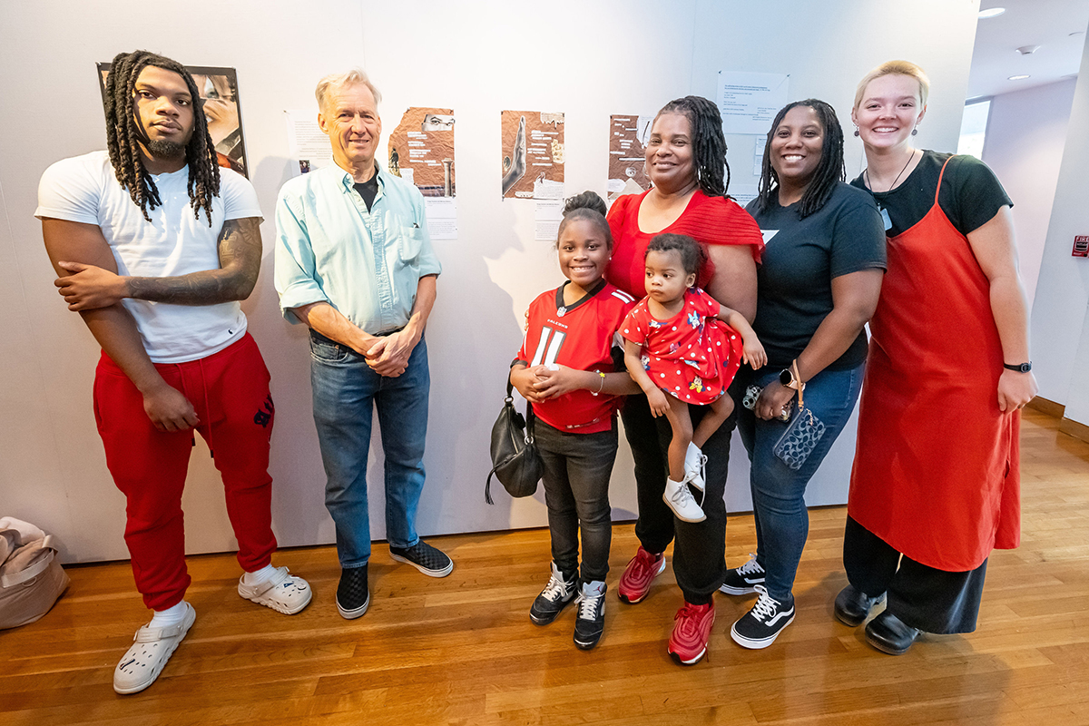 Paige poses with her family