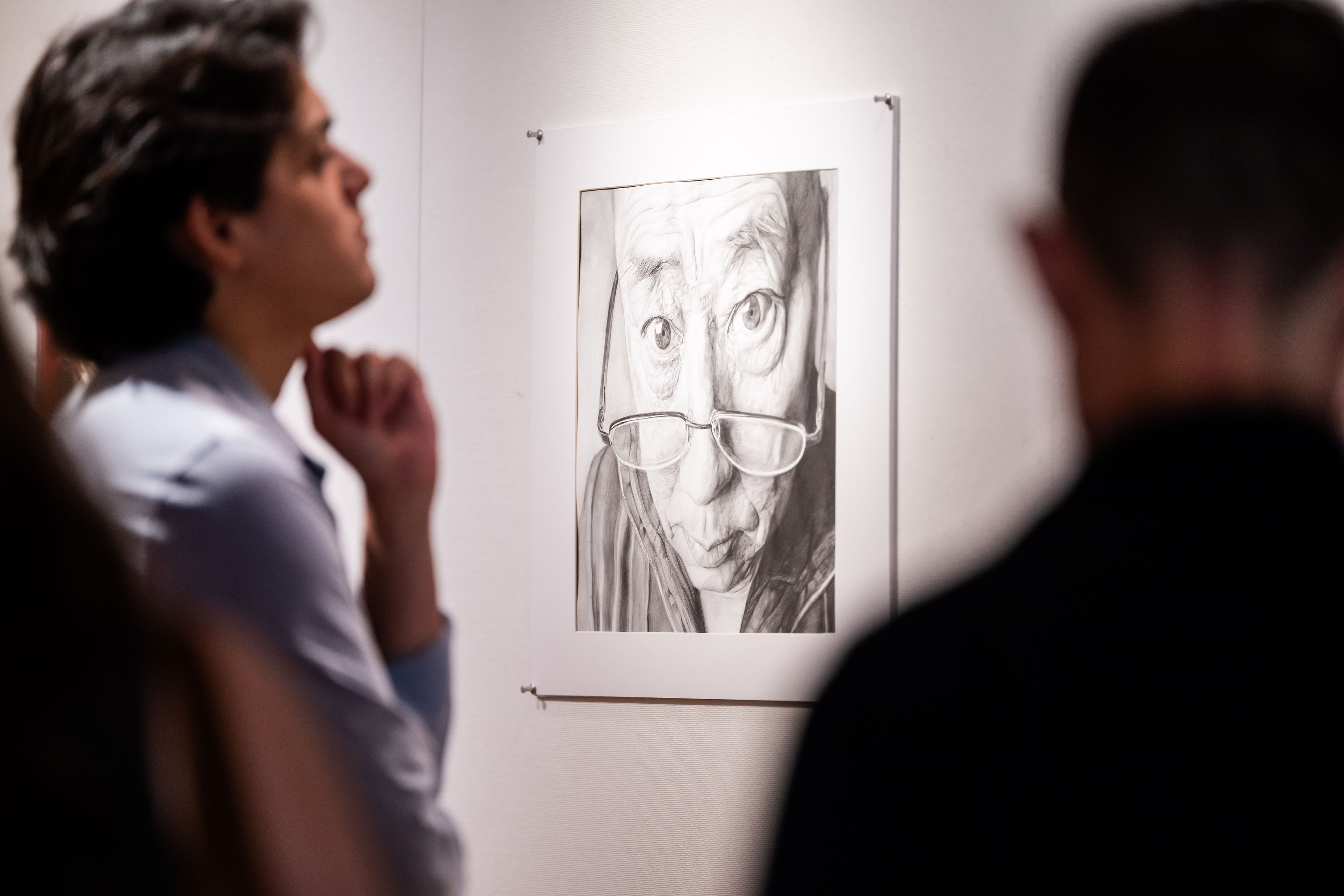 Sketch of a man looking over his glasses