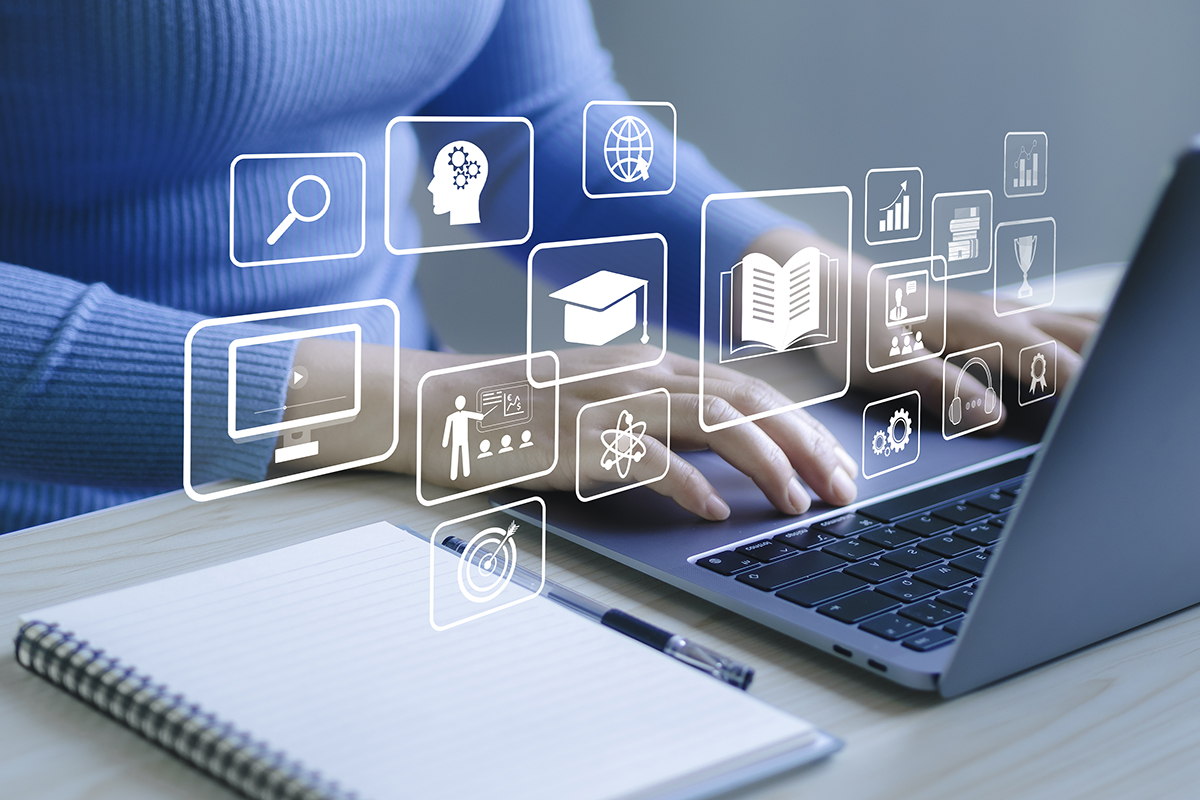 Image of a person typing on a computer
