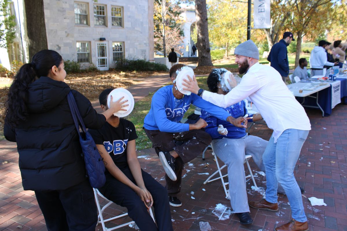 students playing a "pie in face" game