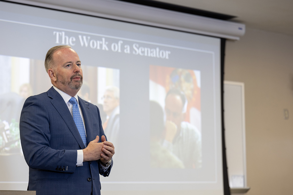 LeMieux in front of slideshow