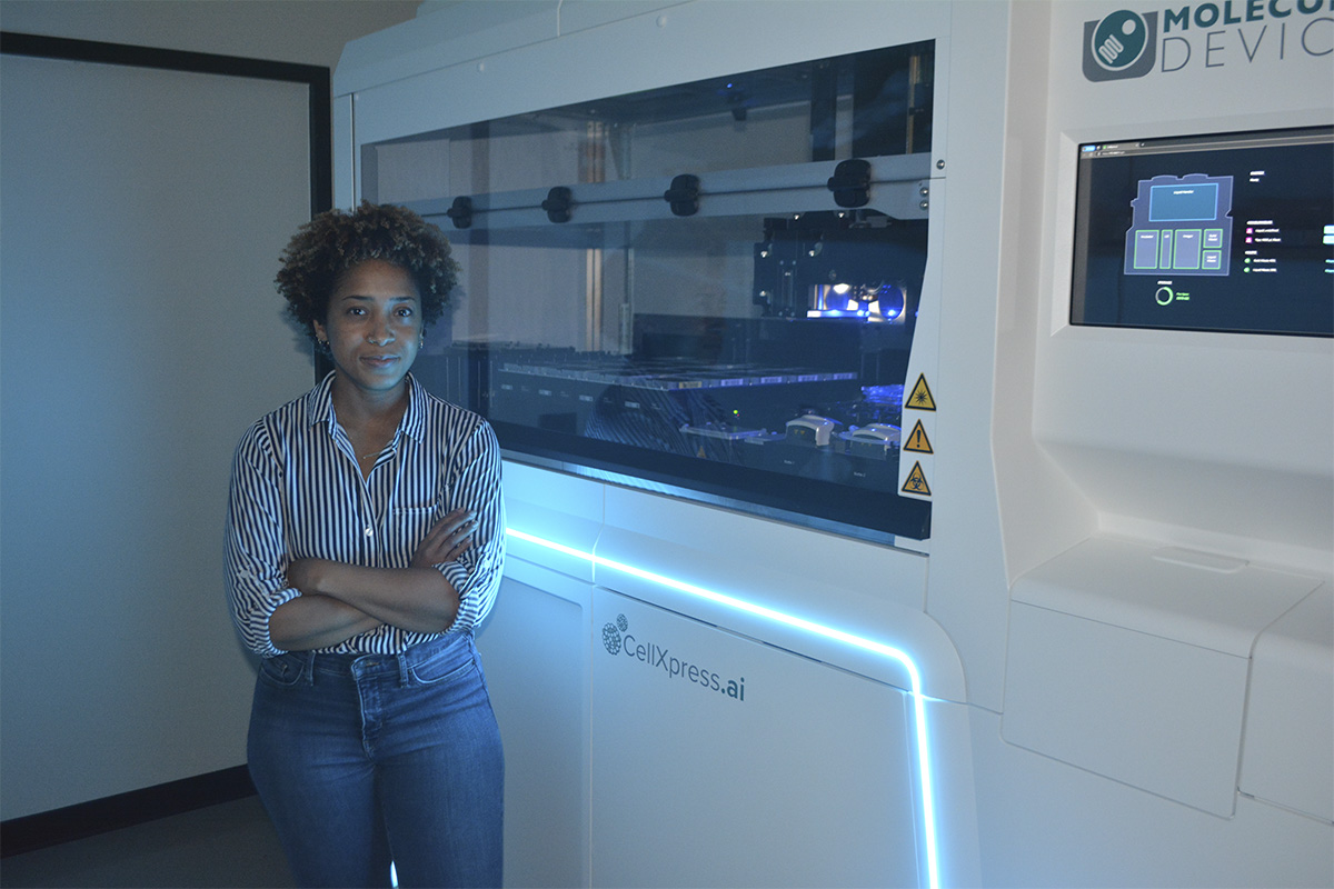 woman standing in front of medical screening equipment
