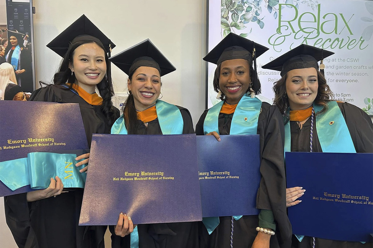 college graduates with diploma folders