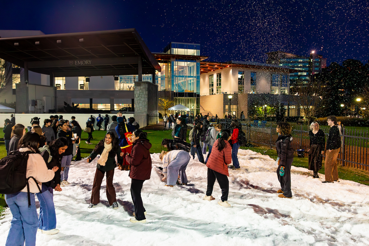 students playing in snow