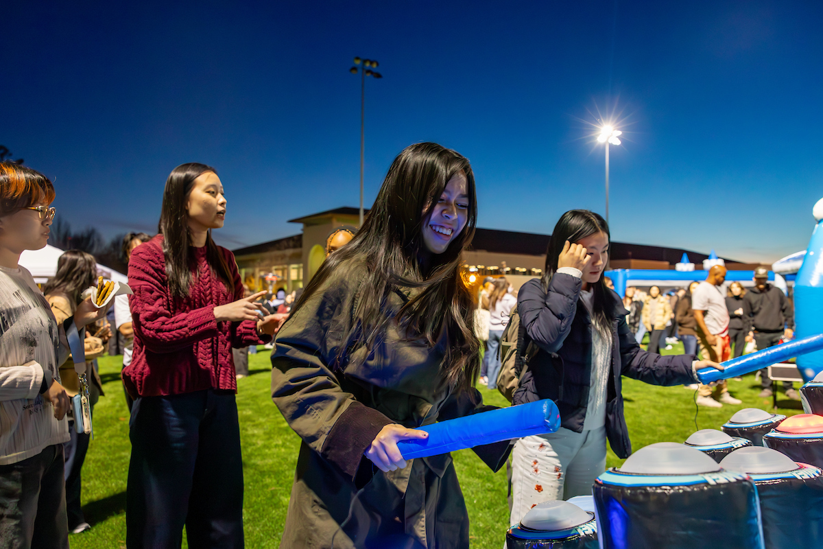 students playing inflatable drums