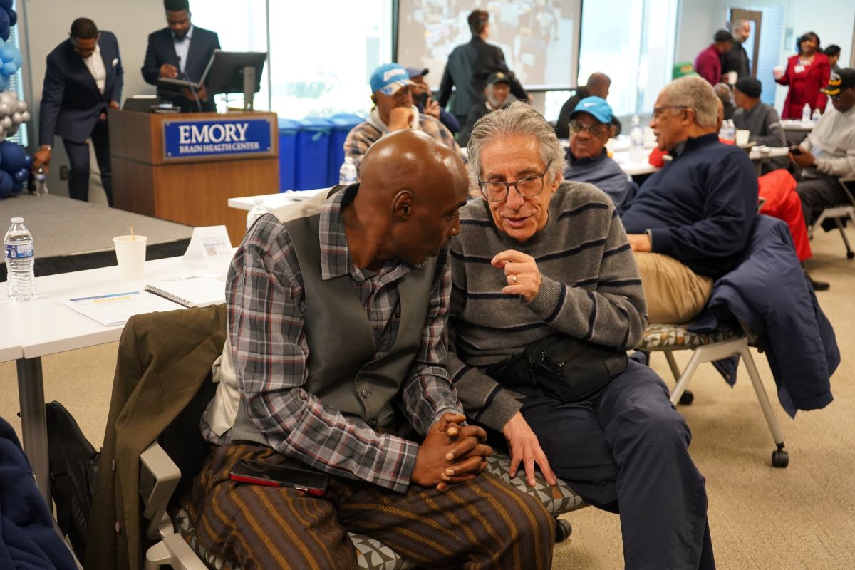 two men speaking together